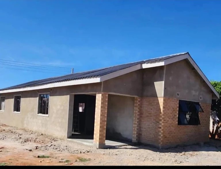 Completed Wozoli-built residential home with brick & plaster finish, Harare
